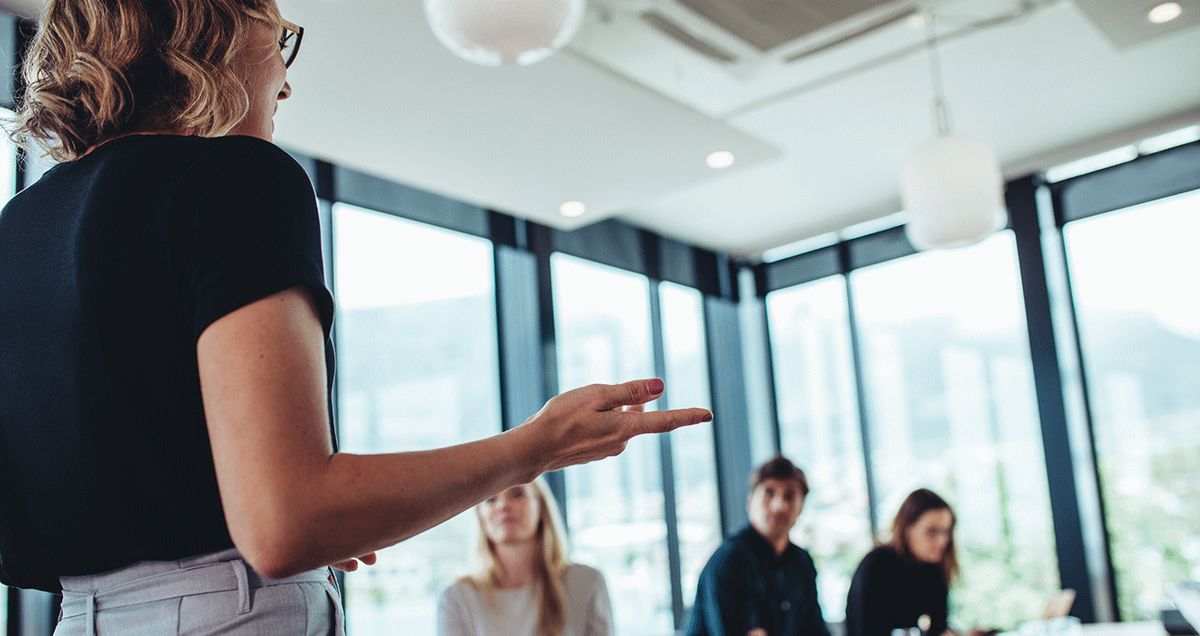 A group of people deliberating in a meeting room